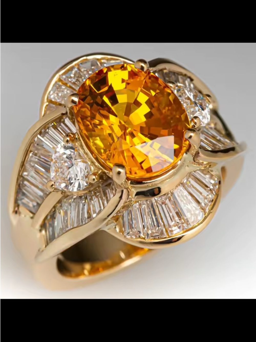 Gold Ring with Oval Orange Center Stone and Diamond Accents